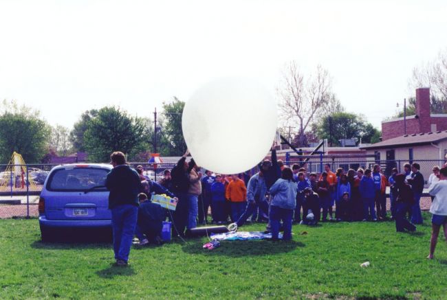 filling balloons in front of kids