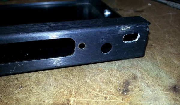 Elongate the hole to the size of a USB mini jack.